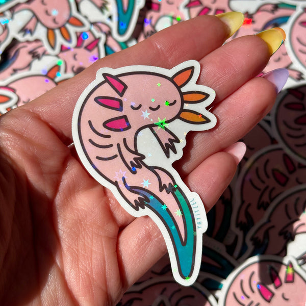 holding one colorful axolotl holographic sticker. it has holographic foil that sparkles in the shape of stars